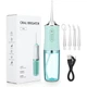 Зубной Ирригатор портативный ORAL IRRIGATOR бытовой ирригатор для полости рта бело-зеленый - изображение 1