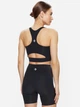 Спортивный топ для бега женский Converse Wordmark Bra Top Black 10024540-001 XS Black (194434082890) - изображение 2