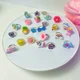 Набір каблучок для дівчаток Lovely Rings набір колечок дитячих регульовані перстені прикраси для дівчаток біжутерія 24 шт. - зображення 3