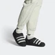 Чоловічі сліпони adidas Puffylette GY4559 42 (8UK) 26.5 см CЧорні/Greone/CЧорні (4065426935127) - зображення 4