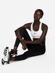 Спортивный топ для фитнеса женский Nike Bra DX6821-100 XL Белый/Лиловый/Черный (0196608850779) - изображение 3