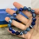 Браслет из натурального камня Агат глазковый синий круглые бусины длина обхвата 18 см стрейч упакован в коробочку (13008) - изображение 3