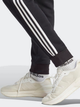 Spodnie dresowe męskie ocieplane adidas Fleece 3-Stripes Tapered Cuff IB4030 L Czarne (4066762306268) - obraz 5