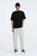 Футболка H&M Loose Fit XS чорний 1003662002 - изображение 1