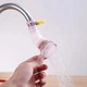 Гнучка висувна насадка фільтр для води, водоочищувач на кран / змішувач, що обертається на 360°, рожевий (84392027) - зображення 1