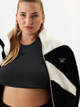 Толстовка на блискавці утеплена на флісі жіноча Reebok Cl Winter Tracktop 100208561 2XS Чорна (1200143802847) - зображення 4