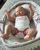 Реалистичная кукла Reborn Baby малыш Pickle в полный рост 60 см (набор одежды в подарок) - изображение 7