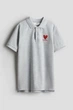 Футболка-поло светло-серый Кит Харинг H&M H&M 170см (400098542) - изображение 1