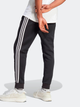 Spodnie dresowe męskie ocieplane adidas Fleece 3-Stripes Tapered Cuff IB4030 M Czarne (4066762309986) - obraz 2