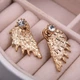 Серьги-гвоздики с камнем Крылья легкости золотистые - изображение 9