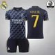 Футбольна форма Lion SPORT Real Madrid VINI JN. (ВІнісіус Жуніор) 7, розмір 20 на зріст 120-125 см, чорна з помаранчевим - зображення 1