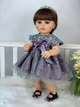 Музична вінілова лялька ручної роботи Reborn Doll у ошатному фіолетовому платті (музичний чіп, видає звуки) - зображення 1