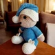 М'яка плюшева іграшка handmade Ведмедик 34 см бежево-біло-синій у ковпаку в'язаний гачком амігурумі - зображення 7