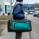Дорожная сумка biz черно-зеленая тканевая для тренировок и поездок на 60 литров - изображение 14