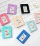 Подарунковий набір Камера для миттєвого друку Fujifilm INSTAX Mini 12 Clay White / Чорний чохол / Картриджі на 50 фото / Чорний фотоальбом на 64 фото - изображение 9