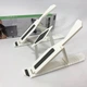 Подставка для ноутбука Multi-Position foldable bracket JC-25 8х22смСтильная подставка. Цвет: белый - изображение 1