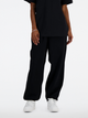 Spodnie dresowe damskie luźne New Balance Nb Athletics WP41513 XS Czarne (197375437675) - obraz 4