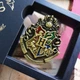 Брошь из фильма Гарри Поттер на одежду / рюкзак / пенал / портфель Harry Potter значок - пин герба школы магии Хогвартс, 5х3.5 см, разноцветный (106931455) - изображение 1