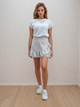 Спідниця міні на запах з воланом Wear me XS Білий (20_25_WM001_11132) - зображення 1