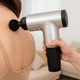 Массажер для тела и мышц аккумуляторный Fascial Gun, беспроводной массажный пистолет с 4 насадками и 6 скоростями, портативный электрический вибромассажер для глубокого массажа спины, шеи, ног, рук Серый, KH-320-Gray - изображение 1