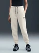 Спортивные штаны на флисе женские Nike W Nsw Tch Flc Mr Jgger 2 HV6779-133 M Молочные (0198485461529) - изображение 1
