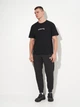 Спортивные штаны утепленные мужские Puma Essentials Graphics 68818201 S Black (4069156535428) - изображение 3