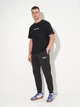 Спортивные штаны мужские утепленные Puma Essentials Graphics 68818701 S Black (4069156535664) - изображение 3