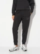 Спортивные штаны на флисе женские Puma Essentials Graphics 68807401 XL Black (4069157462785) - изображение 1