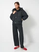 Куртка демисезонная короткая с капюшоном женская Converse 10026796-001 L Черная (194435062617) - изображение 3