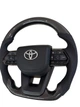 Анатомический руль с подушкой из кожи для Toyota Land Cruiser 200, Prado 150. С подогревом. Карбон. Логотип хром. - изображение 2