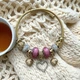 Браслет Twisted Rope с подвесками в форме сердец и шармами - Pink&Gold - изображение 2
