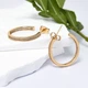 Сережки кільця 57162 Сережки кільця Доріжка 57162 розмір 25х2 мм білі фіаніти вага 4.0 г позолота 18К 13х7 мм білі фіаніти вага 2.4 г позолота 18К - зображення 1