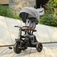 Трехколесный детский складной велосипед Tri-Cycle RITO DELUXE 5-в-1 серый прогулочный трансформер от 12 месяцев с родительской ручкой защитным козырьком и надувными колесами 10″ - изображение 11