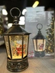 Музыкальный новогодний фонарь "Санта Клаус" XMAS WDL 24077A 14×22×14 см, с подсветкой и метелью, от 3 батареек и сети - изображение 2