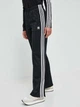 Брюки женские Adidas Originals Adicolor Classic Firebird IL8763 L Черные (4066761179894) - изображение 6