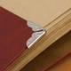 Металлические винтажные уголки для книг, блокнотов, альбомов, аксессуаров 1.4х2 см. 20 шт. Серебристый - изображение 6