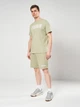 Шорты хлопковые короткие мужские Puma Essentials Graphics 69179082 2XL Lux Army (4069161975639) - изображение 3