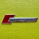 Эмблема шильдик логотип значок Supercharger наклейка на крылья Аudi ХРОМ С КРАСНЫМ (1шт) 4F0 853 601 A 2ZZ - изображение 5
