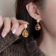 Сережки набір 3 пари з імітацією бурштину золотисті (sergi_3_jantar) - зображення 3