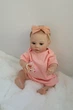 Лялька Реборн Reborn Doll 50 см, реалістична вініл-силіконова дівчинка пупс в рожевому одязі+аксесуари - зображення 2