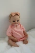 Лялька Реборн Reborn Doll 50 см, реалістична вініл-силіконова дівчинка пупс в рожевому одязі+аксесуари - зображення 4