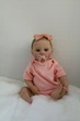Лялька Реборн Reborn Doll 50 см, реалістична вініл-силіконова дівчинка пупс в рожевому одязі+аксесуари - зображення 6