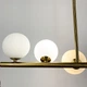 Удлиненная латунная люстра BALLS WAVE с 11 белыми плафонами | Line F | Арт. MJ191-1120 AB+WT - изображение 4