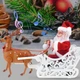 Музыкальная игрушка "Санта Клаус с оленем на санях" - изображение 1