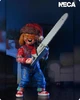 Коллекционная фигурка Чаки Holiday Edition / Chucky Ultimate Action Figure – фигурка ужасов с аксессуарами, сменными головами и оружием, 15 см - изображение 12