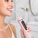 Ирригатор для полости рта портативный аккумуляторный 200 мл Oral Irrigator, с 4 насадками для ухода за зубами, деснами и брекетами Розовый, AND-1-37-Pink - изображение 1