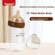 Пляшечка Beingmate Anti-Colic 240 мл скляна антиколикова зі зміщеною соскою коричнева - зображення 3