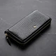 Гаманець для жінок ST Leather великий горизонтальний чорного кольору з натуральної шкіри (bg184fash37) - зображення 1