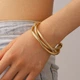 Браслет потрійний багатошаровий Fashion Jewelry переплетені ланцюги масивний біжутерія, золотистий колір (SVS) - зображення 1