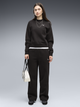 Спортивний костюм жіночий Puma Tracksuits 69399501 XL Black (4070033548356) - зображення 1